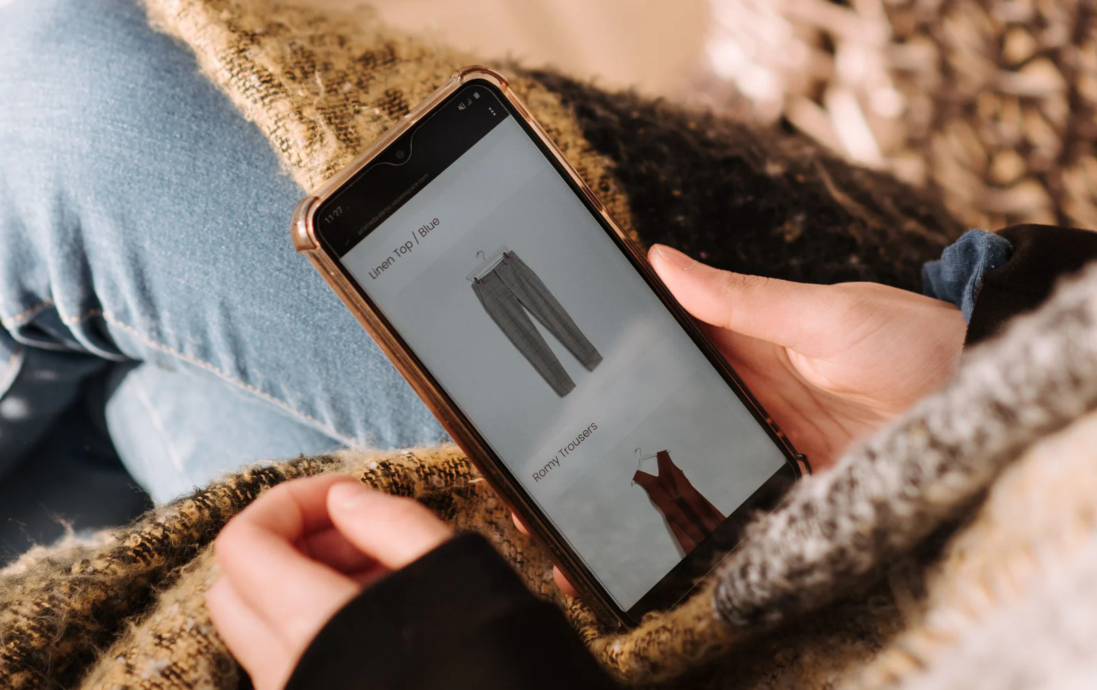 A person browsing a product detail experience on a smartphone